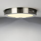 RVS plafondspot LED-opbouwlamp in ronde vorm met matte afwerking, zijdelings aanzicht tegen een witte plafondachtergrond.