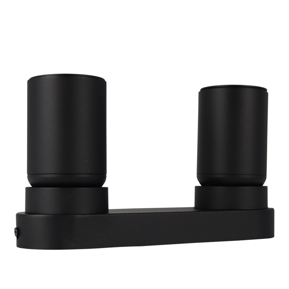 Zwart metalen wandspot met dubbele ronde fittingen, frontaal aanzicht – moderne, minimalistische designlamp voor binnenverlichting.