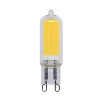 LED G9 capsulelamp in helder glas met zicht op de voorzijde, toont gele COB LED-chip en twee pin-connectoren aan de onderzijde.
