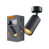 Zwarte Videx GU10 Spotlight met diamantpatroon, moderne plafondspot in schuine vooraanzicht, afgebeeld naast productverpakking.